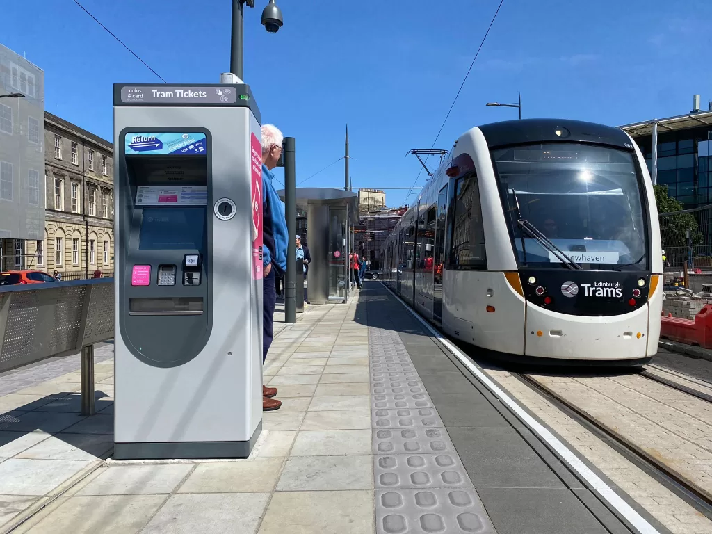 Edinburgh Trams platform with tram and ticket vending machine