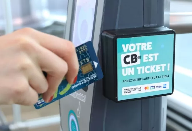 Bank card being used to make contactless fare payment on a bus